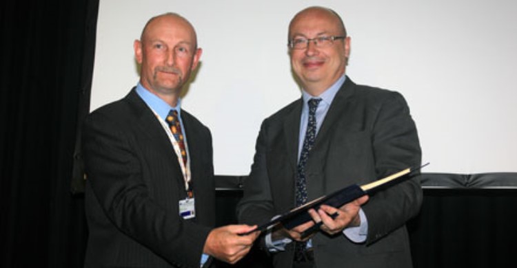 Ambassador Jean-Pierre Thébault (R) signing the Raptors MoU on behalf of the Government of France.